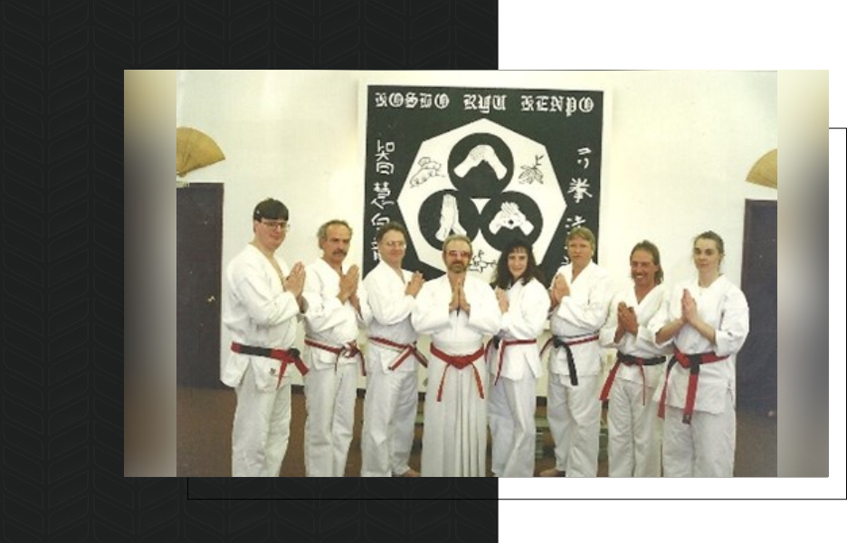 A group of people in white uniforms standing next to each other.